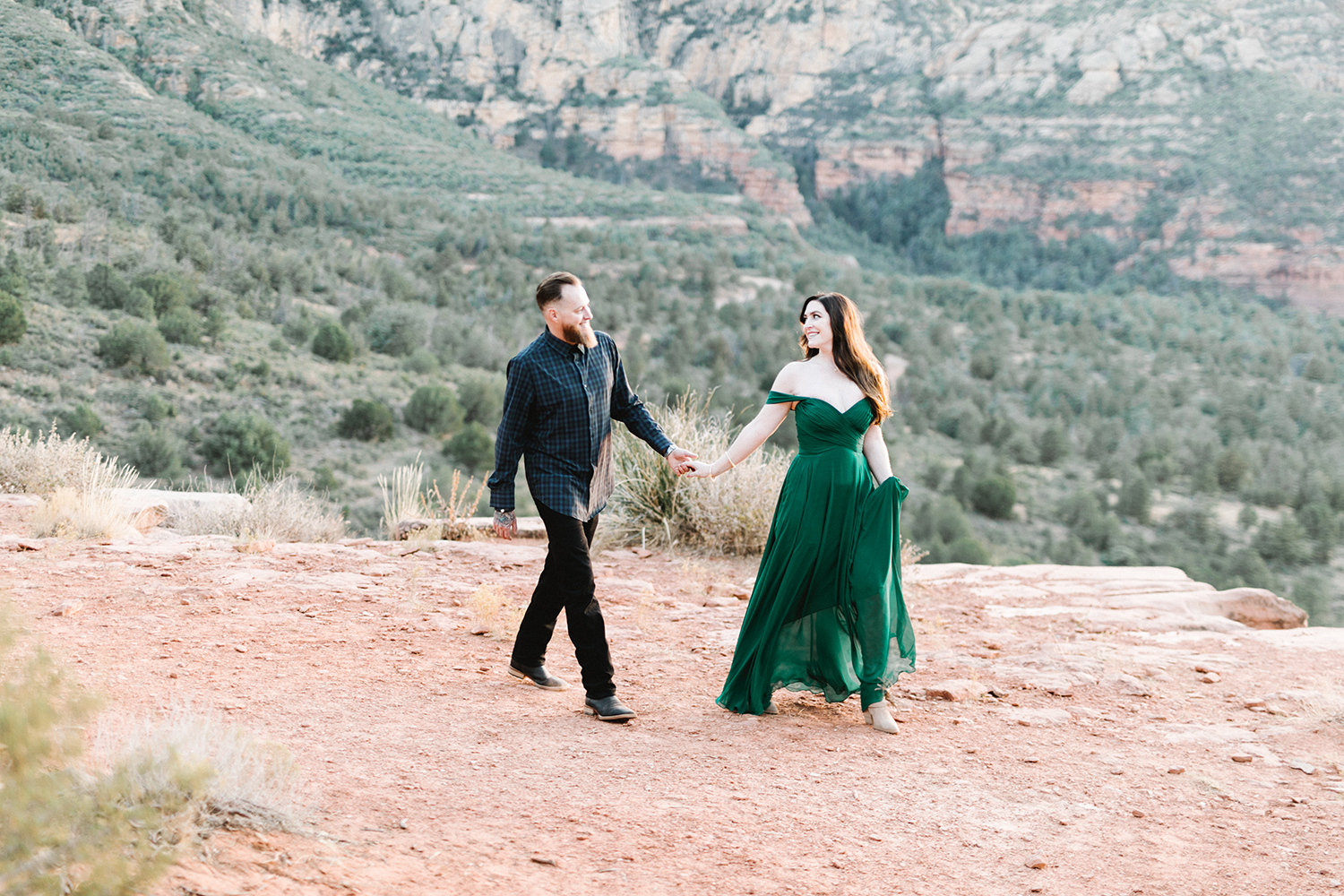 Nicole and Justin's stunning engagement shoot at the gorgeous Merry-Go-Round-Rock in Sedona, Arizona. Head to the blog to get a peek into our time together!#EngagementPhotos #EngagementPhotoIdeas #EngagementPhotoShoot #EngagementPhotoOutfits #EngagementPhotoPoses #ArizonaWedding #ArizonaWeddingIdeas #MerryGoRoundRockSedonaArizona #ScenicSpotsInArizona #SedonaArizona #ArizonaWeddingPhotography #WeddingIdeas #DesertPhotoShoot #ArizonaDesert #DesertLandscape #EngagementPortraits #ArizonaPhotographer #ArizonaPhotography