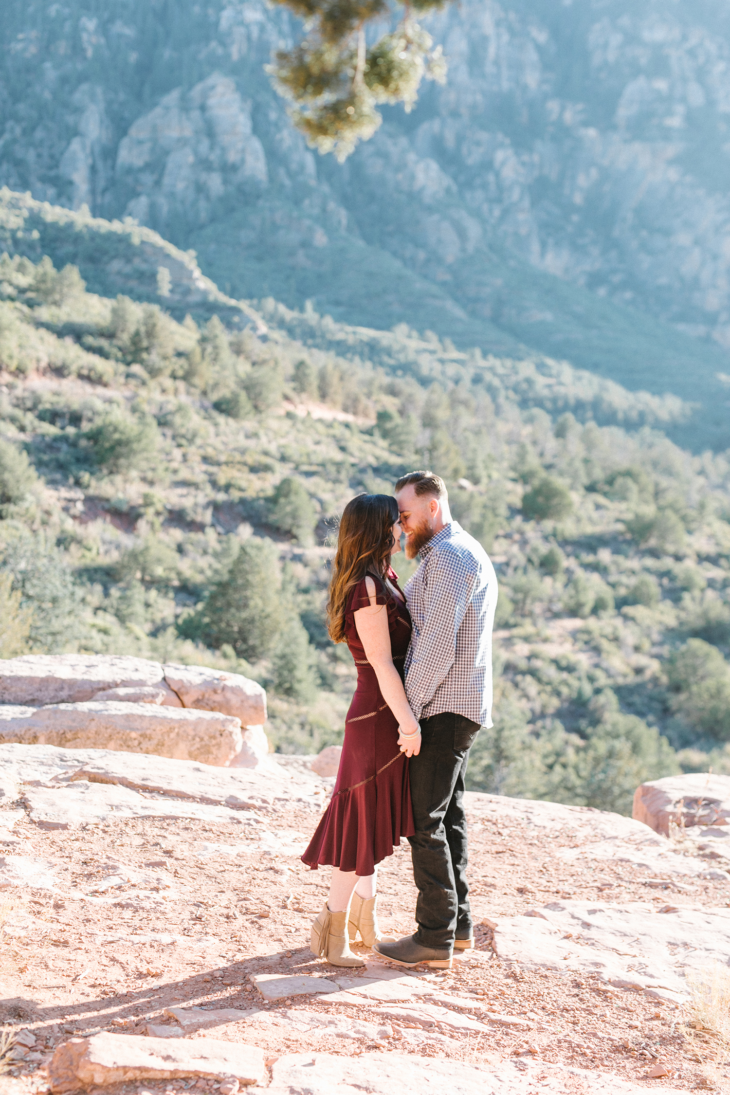 Nicole and Justin's stunning engagement shoot at the gorgeous Merry-Go-Round-Rock in Sedona, Arizona. Head to the blog to get a peek into our time together!#EngagementPhotos #EngagementPhotoIdeas #EngagementPhotoShoot #EngagementPhotoOutfits #EngagementPhotoPoses #ArizonaWedding #ArizonaWeddingIdeas #MerryGoRoundRockSedonaArizona #ScenicSpotsInArizona #SedonaArizona #ArizonaWeddingPhotography #WeddingIdeas #DesertPhotoShoot #ArizonaDesert #DesertLandscape #EngagementPortraits #ArizonaPhotographer #ArizonaPhotography
